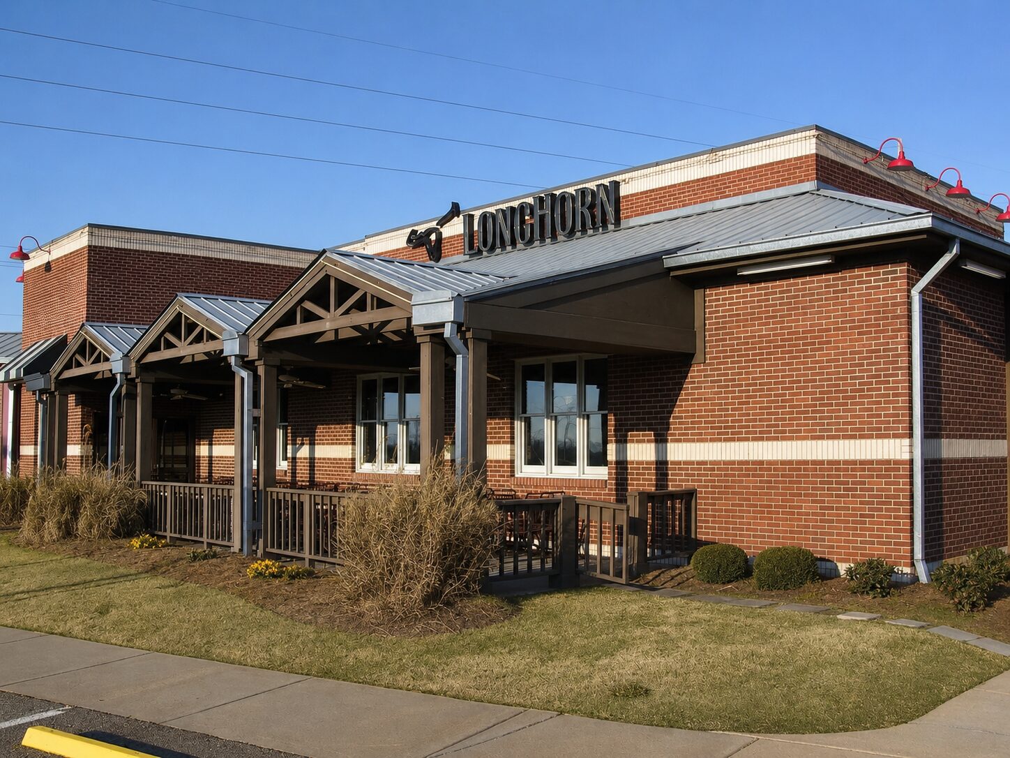 Brick restaurant with a Galvalume metal roof and covered entry