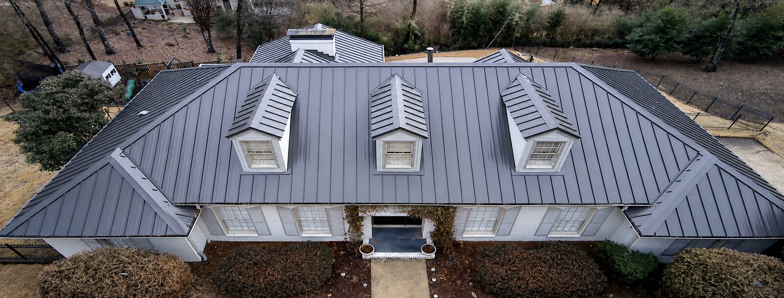Large estate home with a metal roof